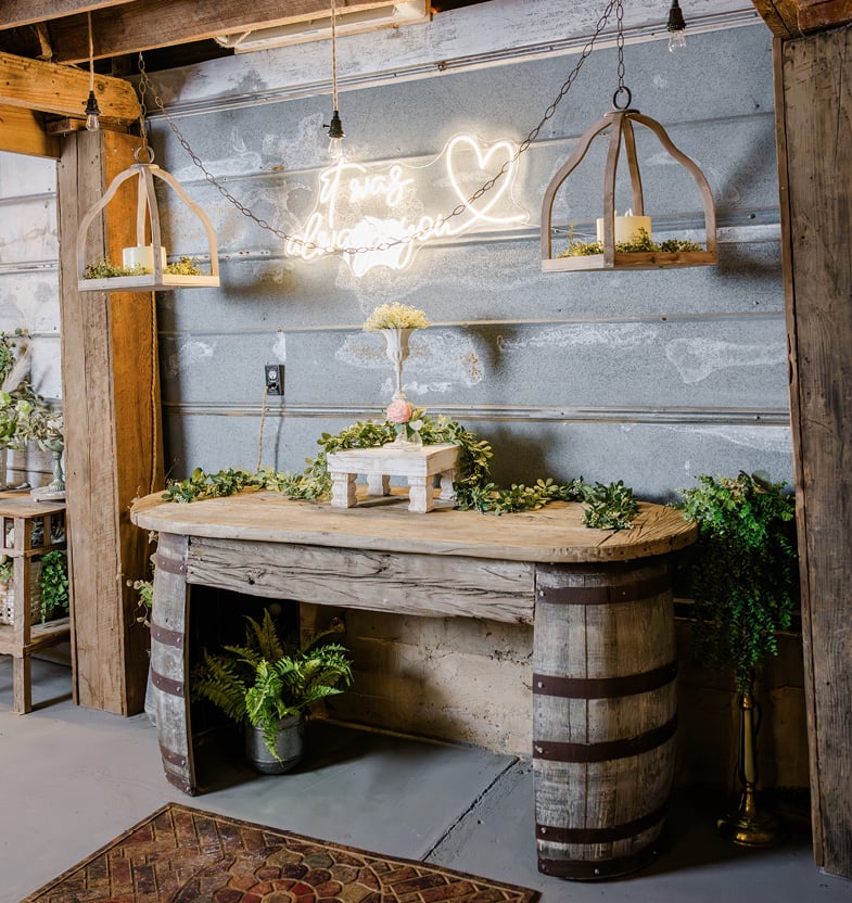 A whiskey barrel was cut in half to build a beverage table.