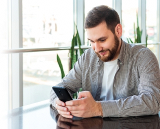 Man looking at his mobile device